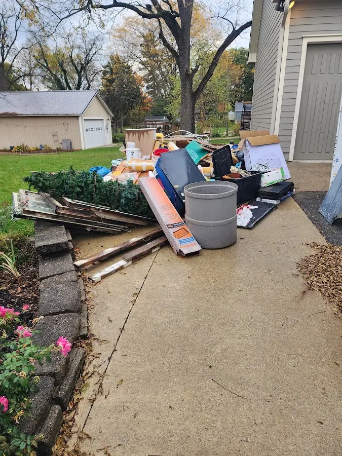 Dumpster being loaded with debris for Commercial Dumpster Rental in Wilton